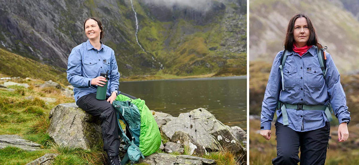 Woman wearing blue outdoors shirts sitting on a rock by a lake nestled in the mountains Woman Wearing Blue Outdoors Shirts Sitting On A Rock By A Lake Nestled In The Mountains