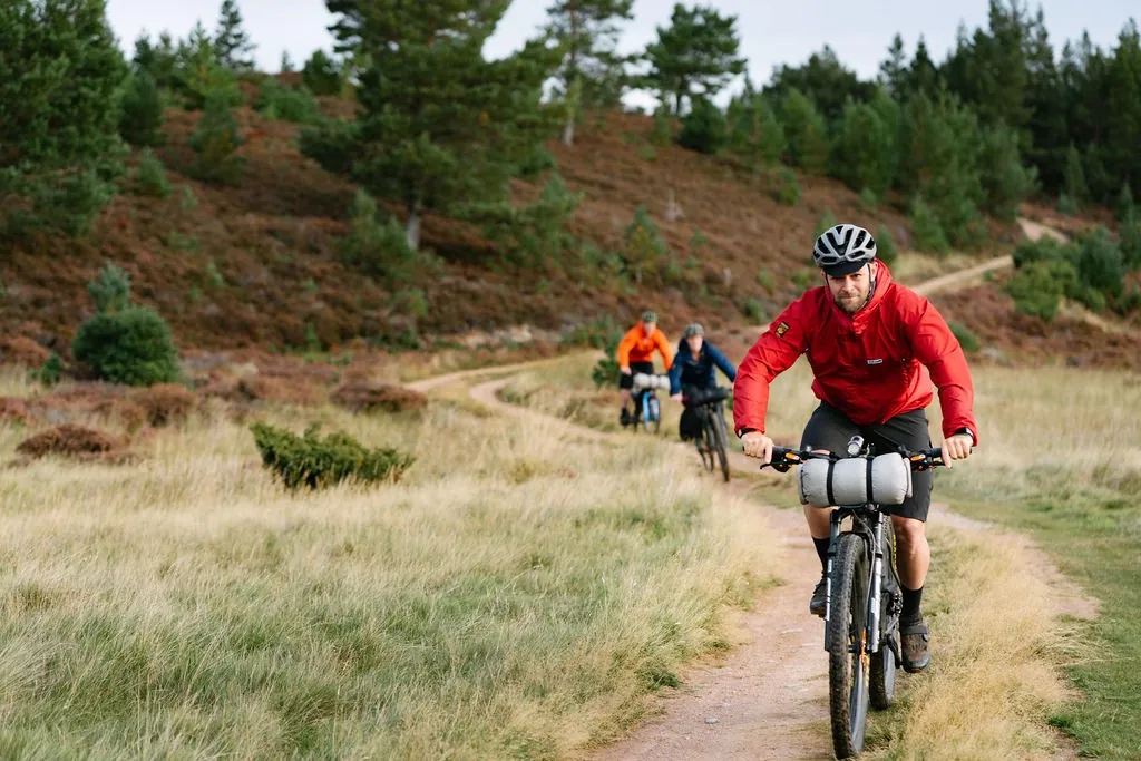Cyclists bikepacking on a moorland trail