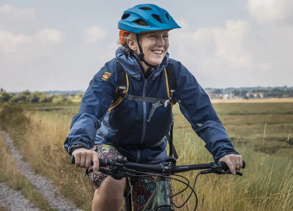 Cyclist in a navy Velez jacket